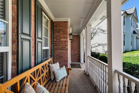 a view of balcony with furniture