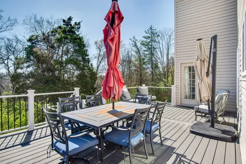 a view of a chairs and table on the deck