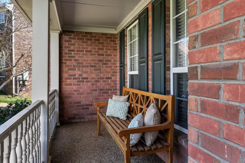 a view of a balcony with furniture