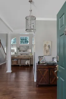 a view of room with furniture and wooden floor