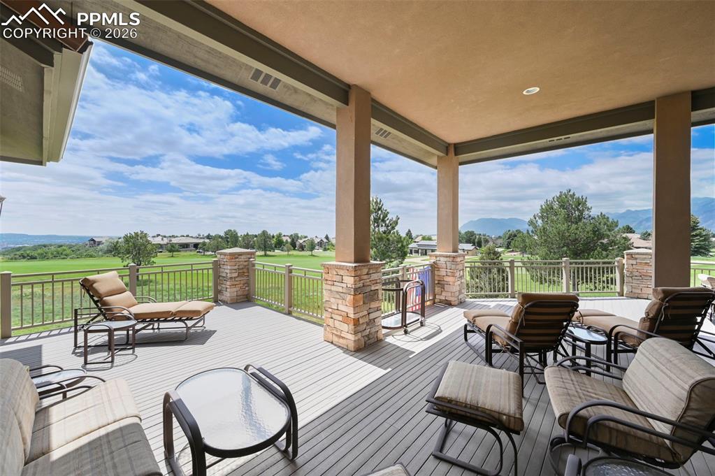 4025 Reserve Point Colorado Springs, CO 80904 - Photo 17 of 50 a living room with furniture and a floor to ceiling window