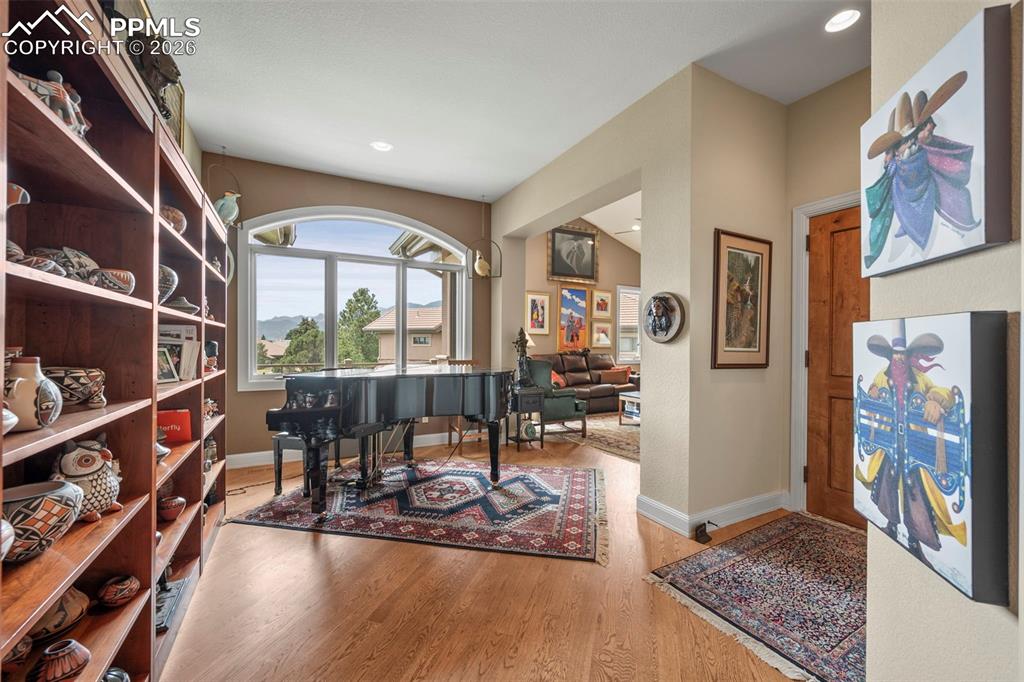 4025 Reserve Point Colorado Springs, CO 80904 - Photo 23 of 50 a living room with furniture and a floor to ceiling window