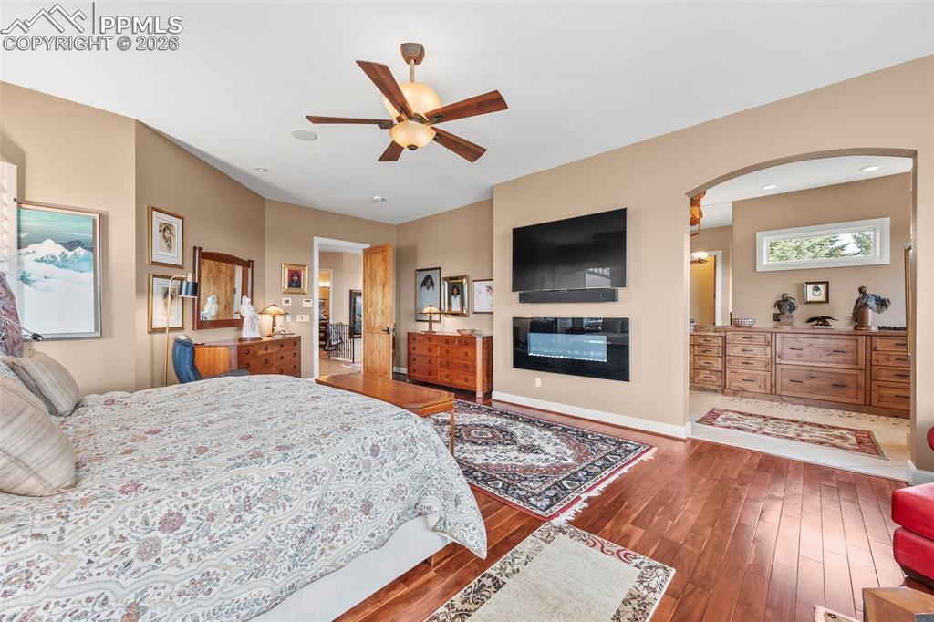 4025 Reserve Point Colorado Springs, CO 80904 - Photo 28 of 50 a living room with a flat screen tv and a fireplace