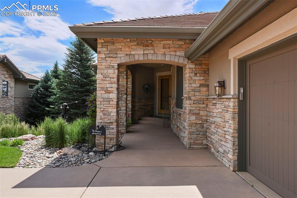 4025 Reserve Point Colorado Springs, CO 80904 - Photo 3 of 50 a view of entryway with garden