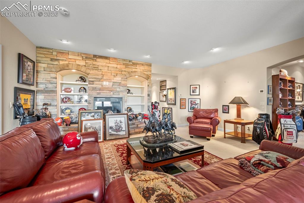 4025 Reserve Point Colorado Springs, CO 80904 - Photo 33 of 50 a living room with furniture and a floor to ceiling window