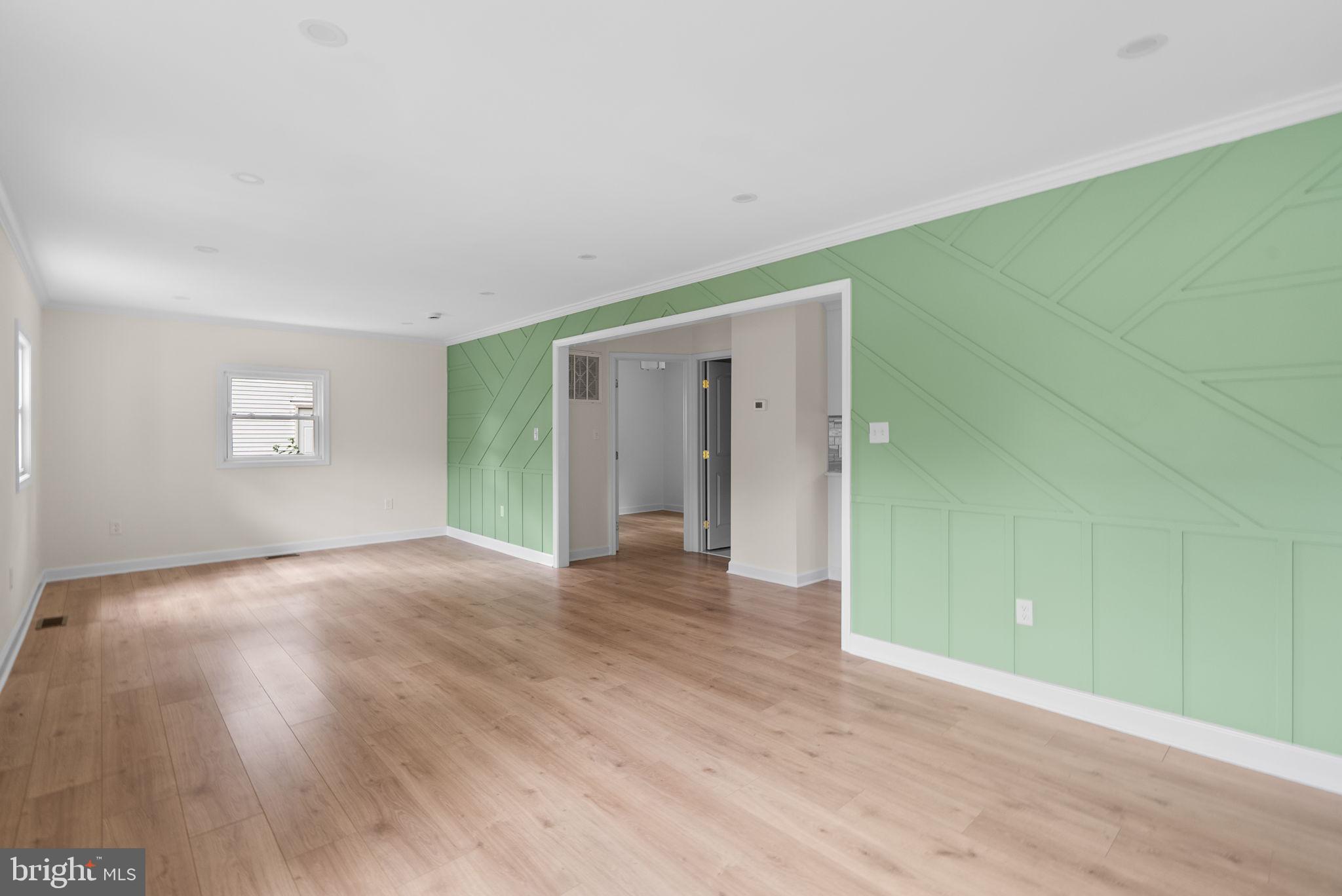 4205 Garrett Park Road Silver Spring, MD 20906 - Photo 11 of 41 a view of empty room with wooden floor and fan