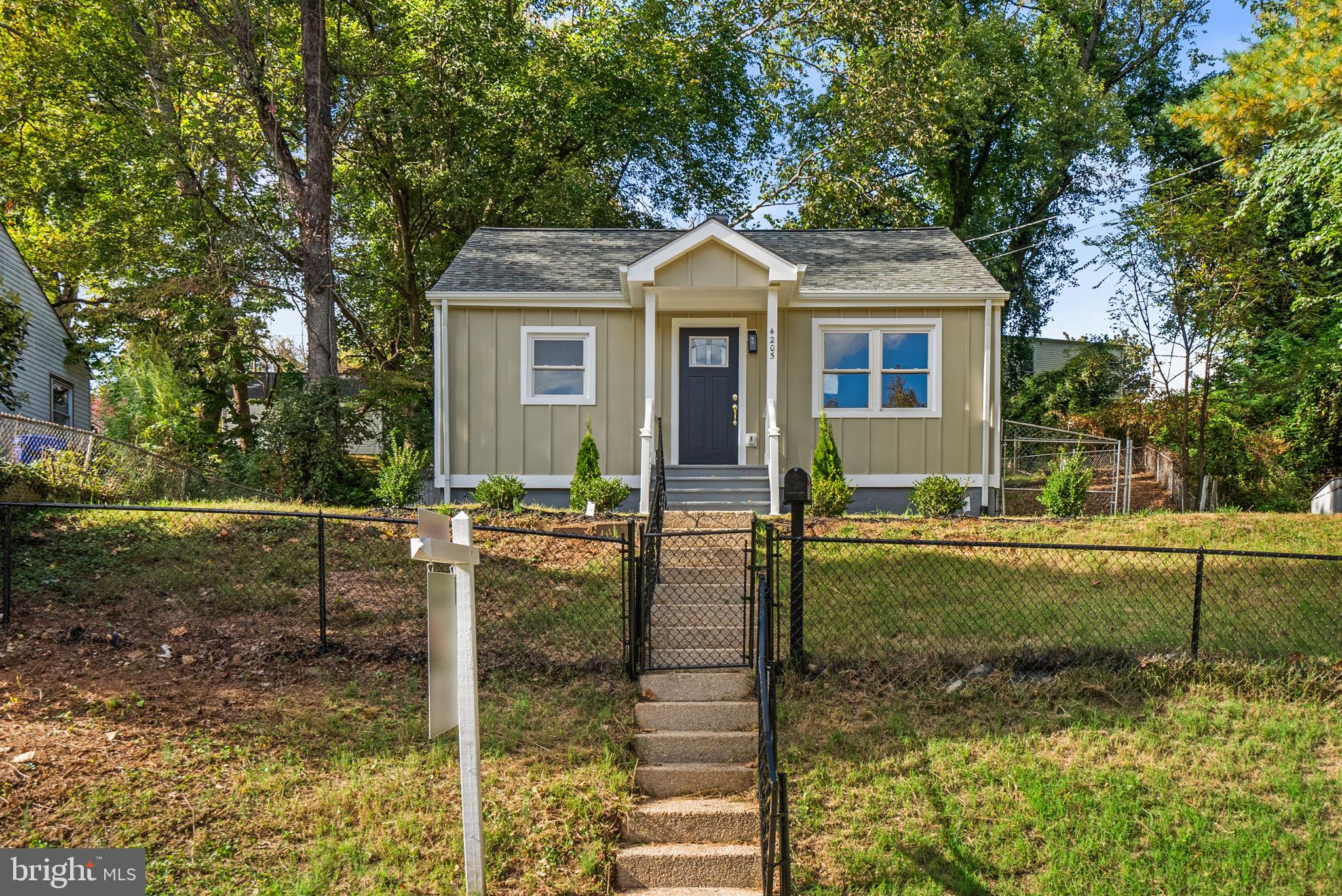 4205 Garrett Park Road Silver Spring, MD 20906 - Photo 2 of 41 a front view of a house with garden