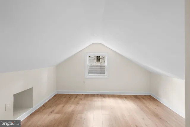 an empty room with a empty space and window