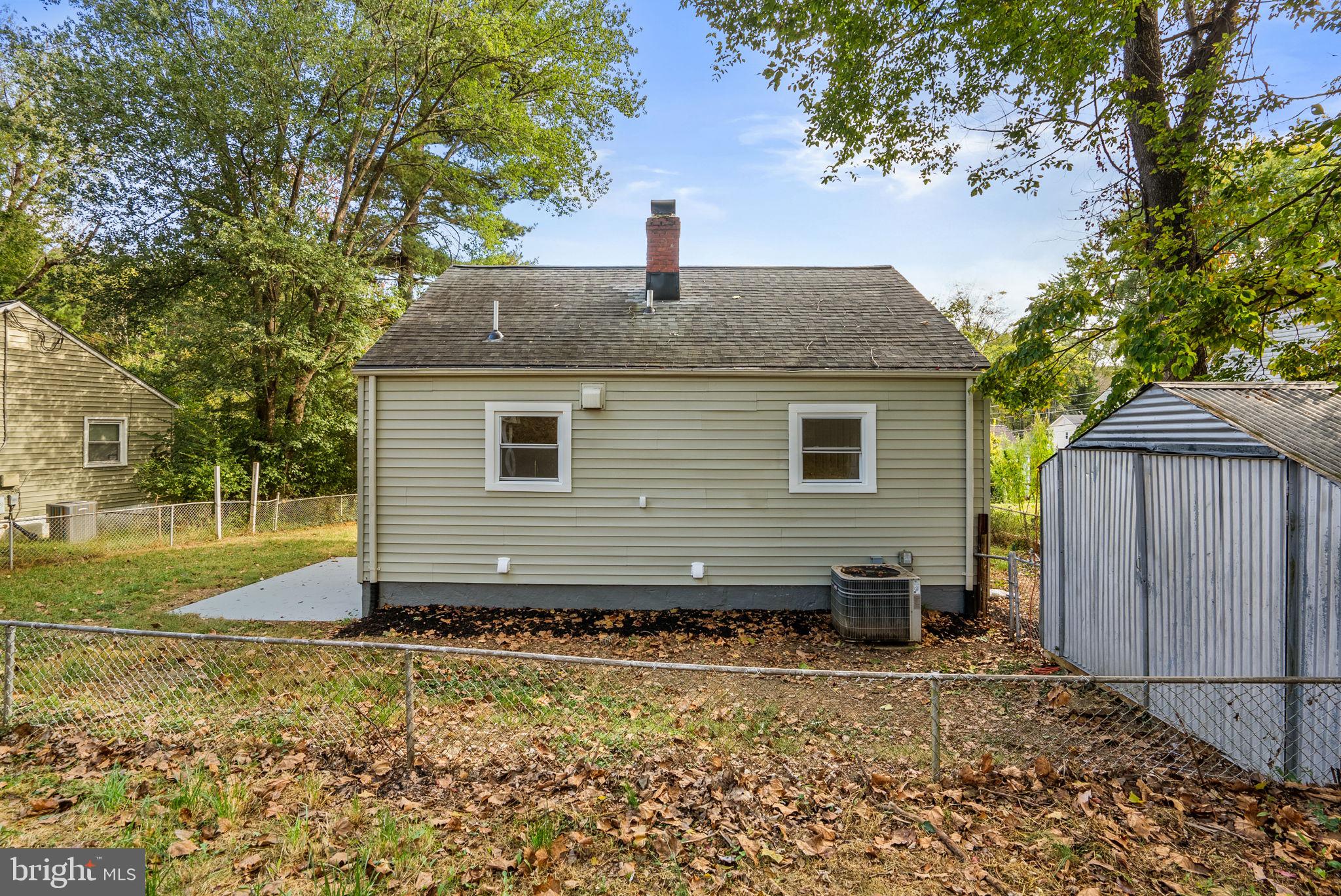 4205 Garrett Park Road Silver Spring, MD 20906 - Photo 40 of 41 a front view of a house with a yard