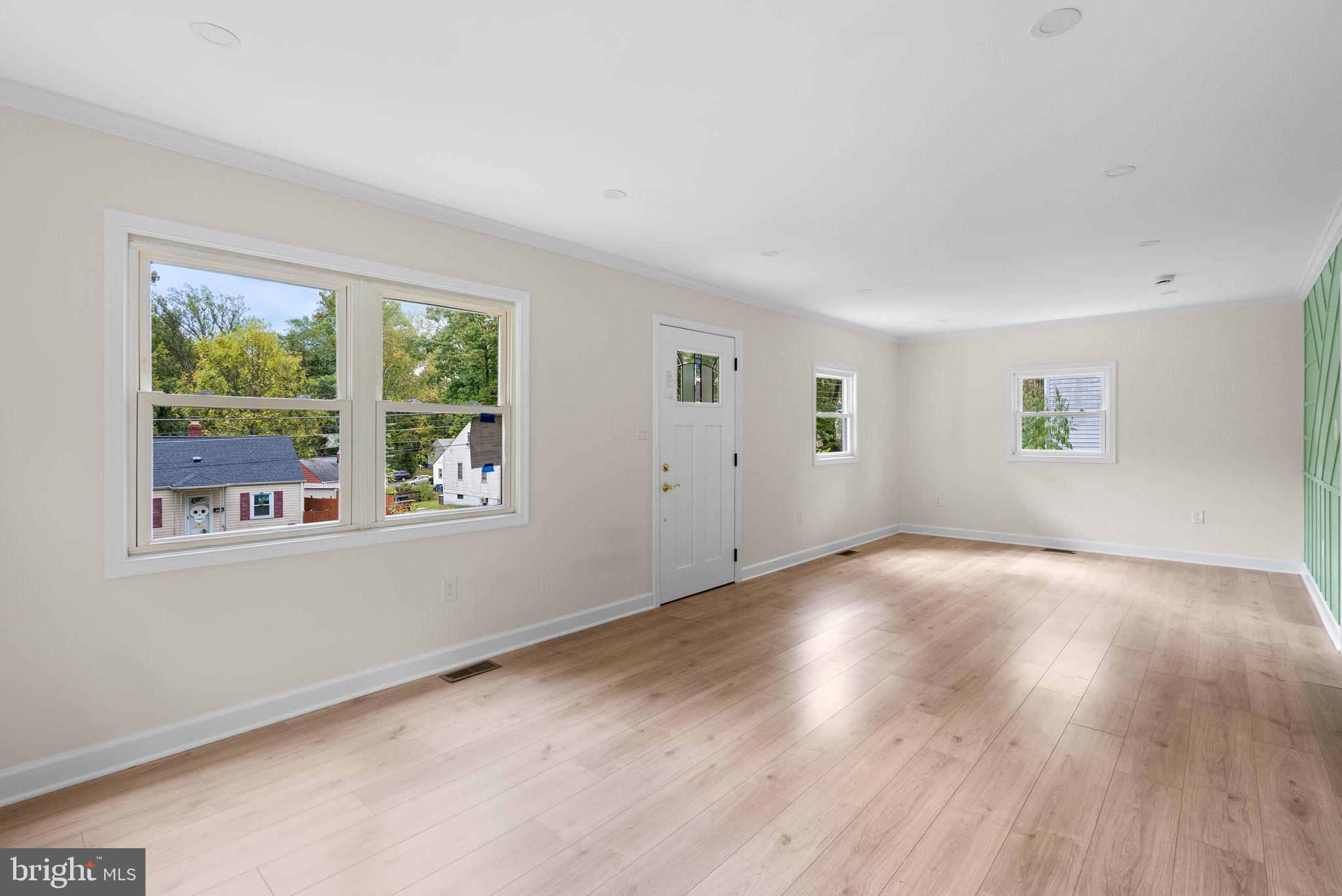 4205 Garrett Park Road Silver Spring, MD 20906 - Photo 6 of 41 a view of empty room with wooden floor and fan