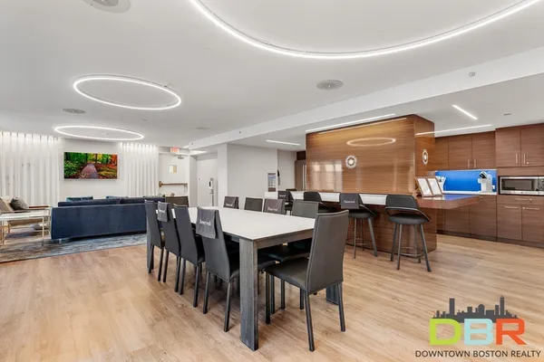 a view of a dining area with furniture and wooden floor
