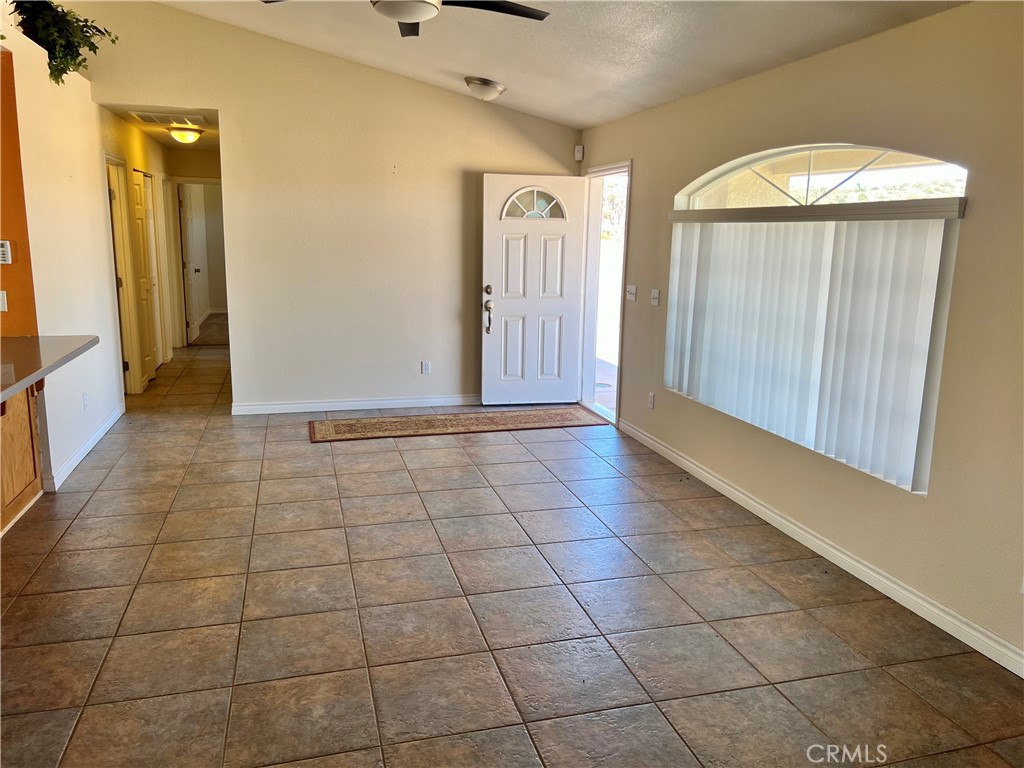 25625 Rancho Street Apple Valley, CA 92308 - Photo 3 of 18 a view of a livingroom with an empty space and a window
