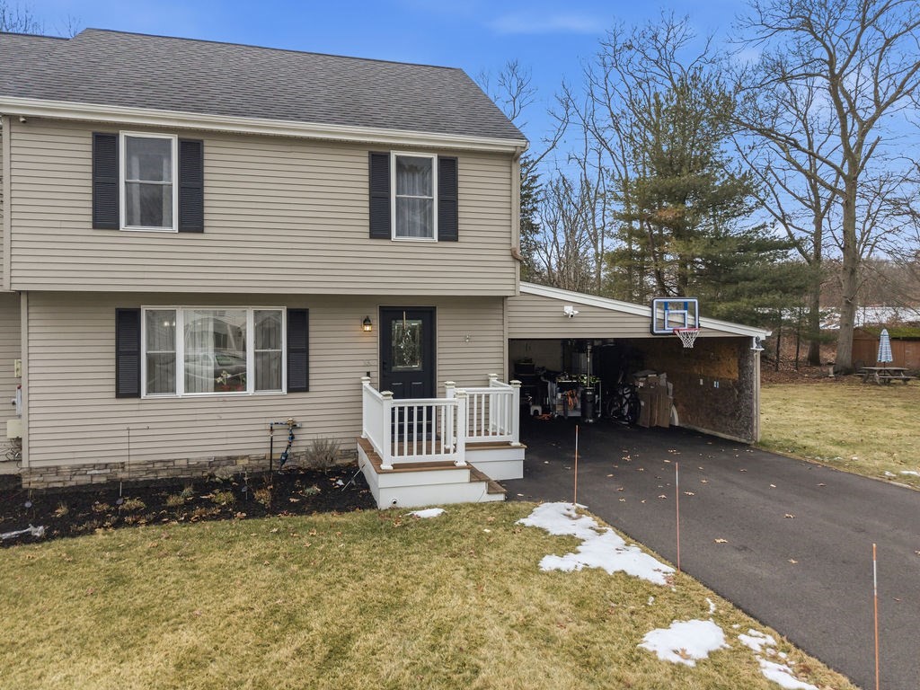 16 Perry Avenue, Unit 16 Taunton, MA 02780 - Photo 2 of 40 a front view of a house with a yard