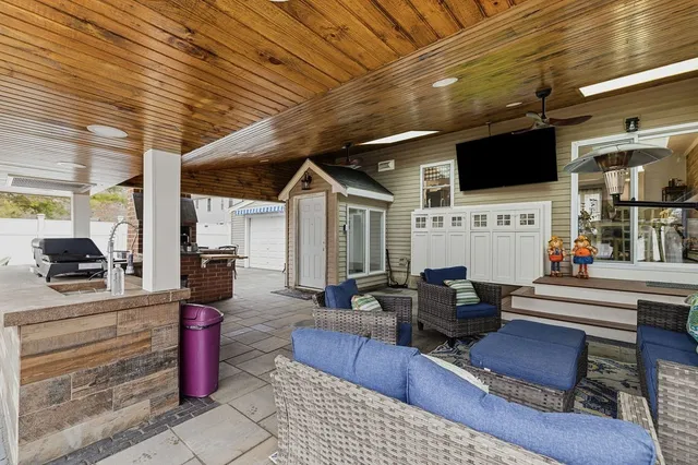 a view of a patio with couches chairs and a table