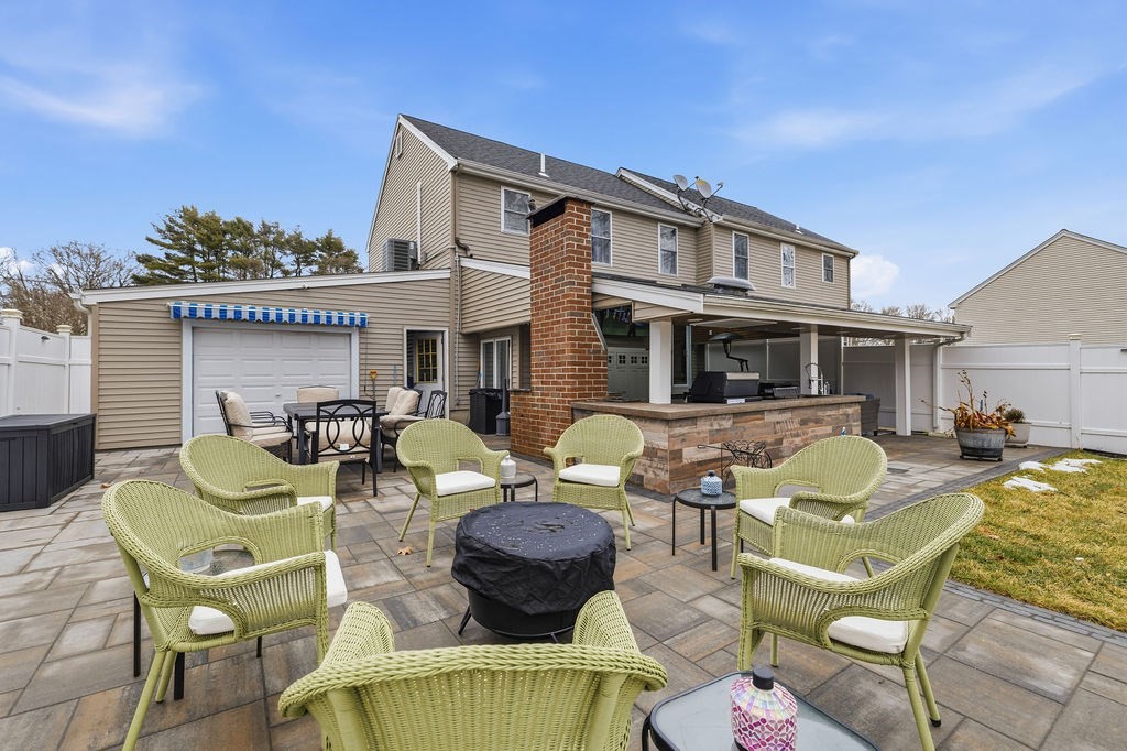 16 Perry Avenue, Unit 16 Taunton, MA 02780 - Photo 27 of 40 a view of a patio with couches chairs and a table