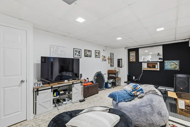 a room with furniture and a flat screen tv