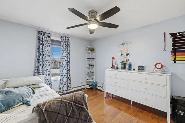 a bedroom with a bed and a dresser