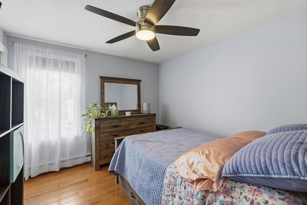 16 Perry Avenue, Unit 16 Taunton, MA 02780 - Photo 37 of 40 a bedroom with a bed and a flat screen tv