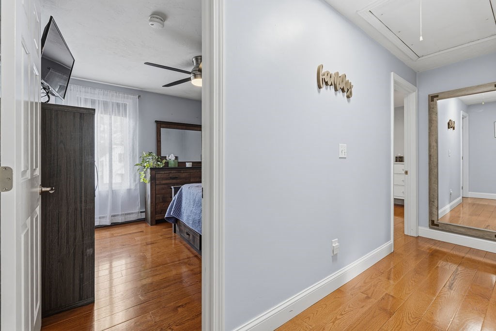 16 Perry Avenue, Unit 16 Taunton, MA 02780 - Photo 40 of 40 a view of a hallway and a livingroom with furniture