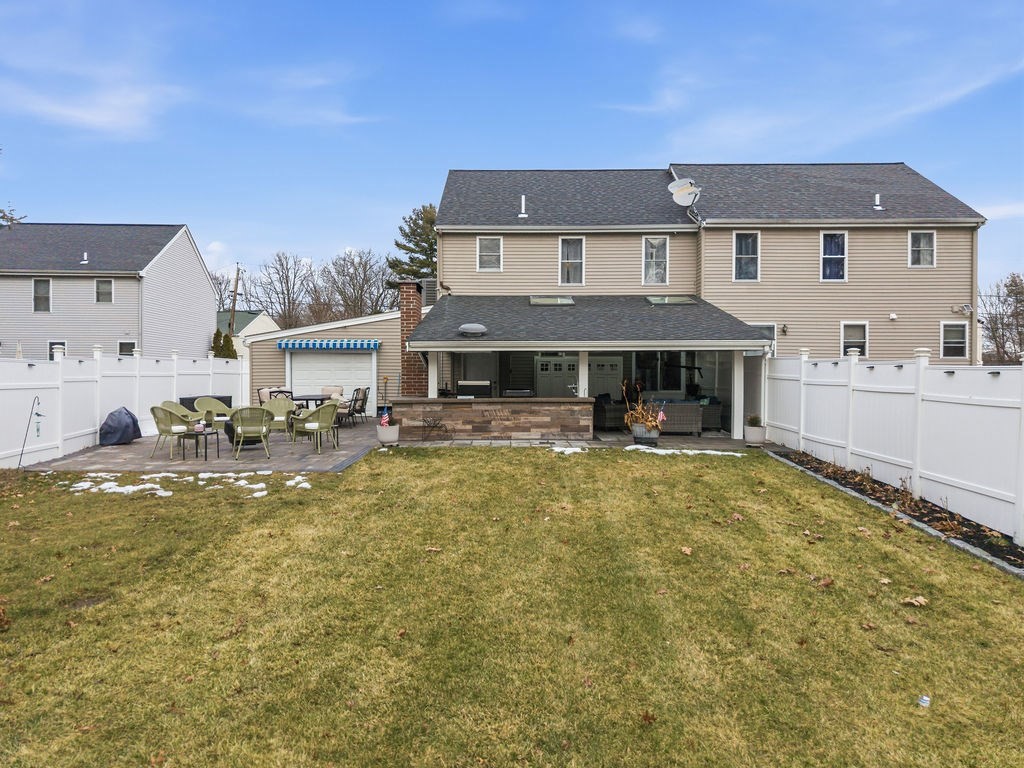 16 Perry Avenue, Unit 16 Taunton, MA 02780 - Photo 5 of 40 a front view of a house with swimming pool