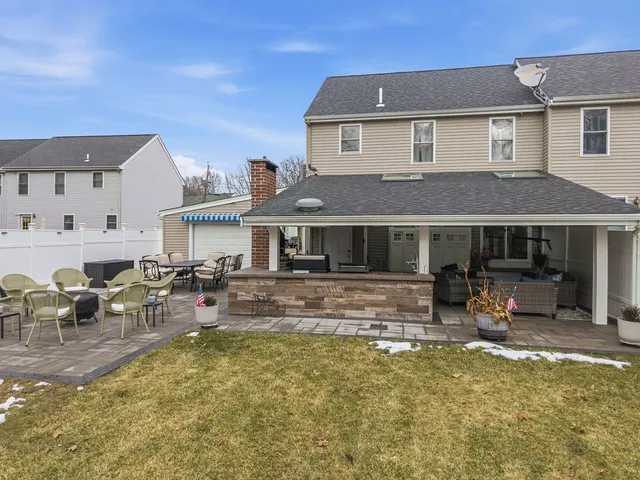 a front view of house with outdoor seating