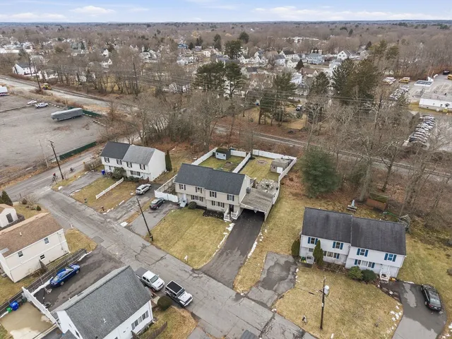 an aerial view of a house with a swimming pool