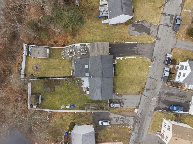 an aerial view of residential houses with outdoor space