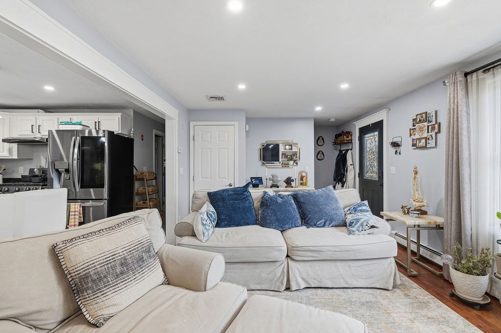 16 Perry Avenue, Unit 16 Taunton, MA 02780 - Photo 10 of 40 a living room with furniture and a large window