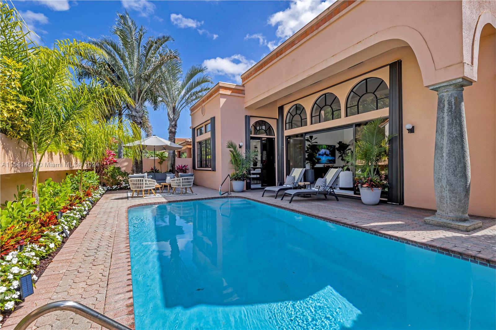 6492 Via Rosa Boca Raton, FL 33433 - Photo 54 of 66 a view of a house with pool and sitting area