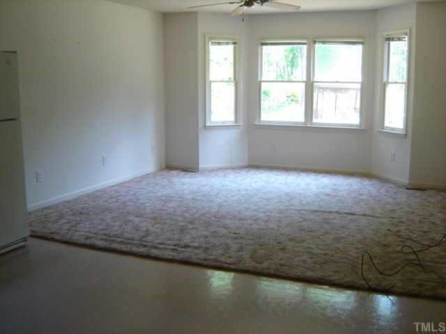 148 Stagecrest Drive Raleigh, NC 27603 - Photo 10 of 12 This is the second living room located in the in-law suite. From the bay window, you see a view of the lovely back yard. Living Room