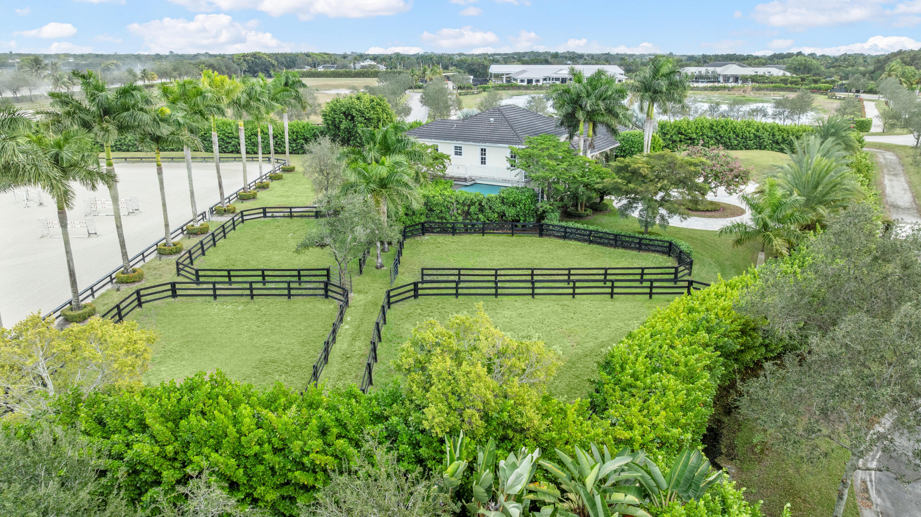 14739 Jumper Road Wellington, FL 33449 - Photo 109 of 124 an aerial view of residential houses with outdoor space and swimming pool