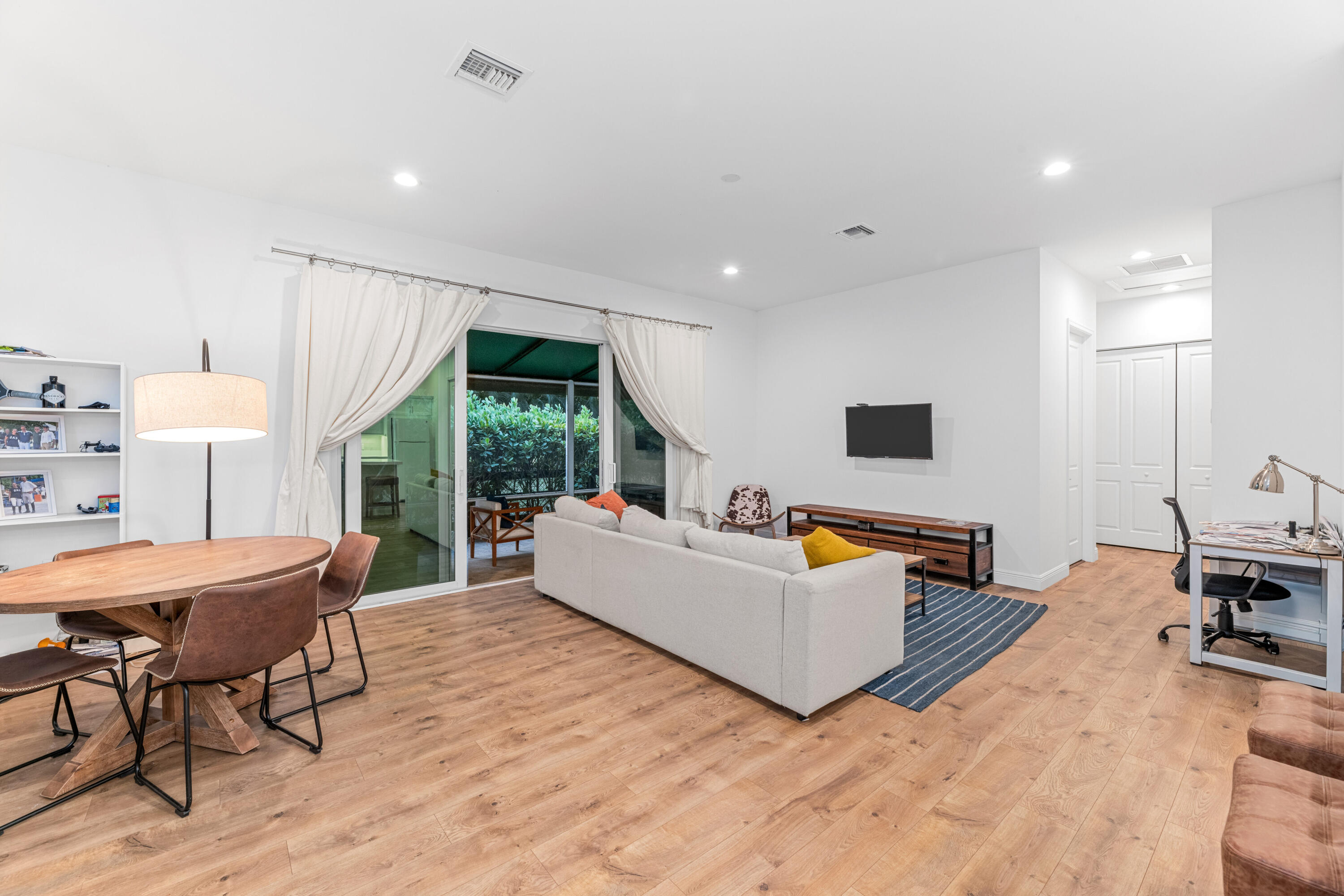 14739 Jumper Road Wellington, FL 33449 - Photo 116 of 124 a living room with furniture and a flat screen tv