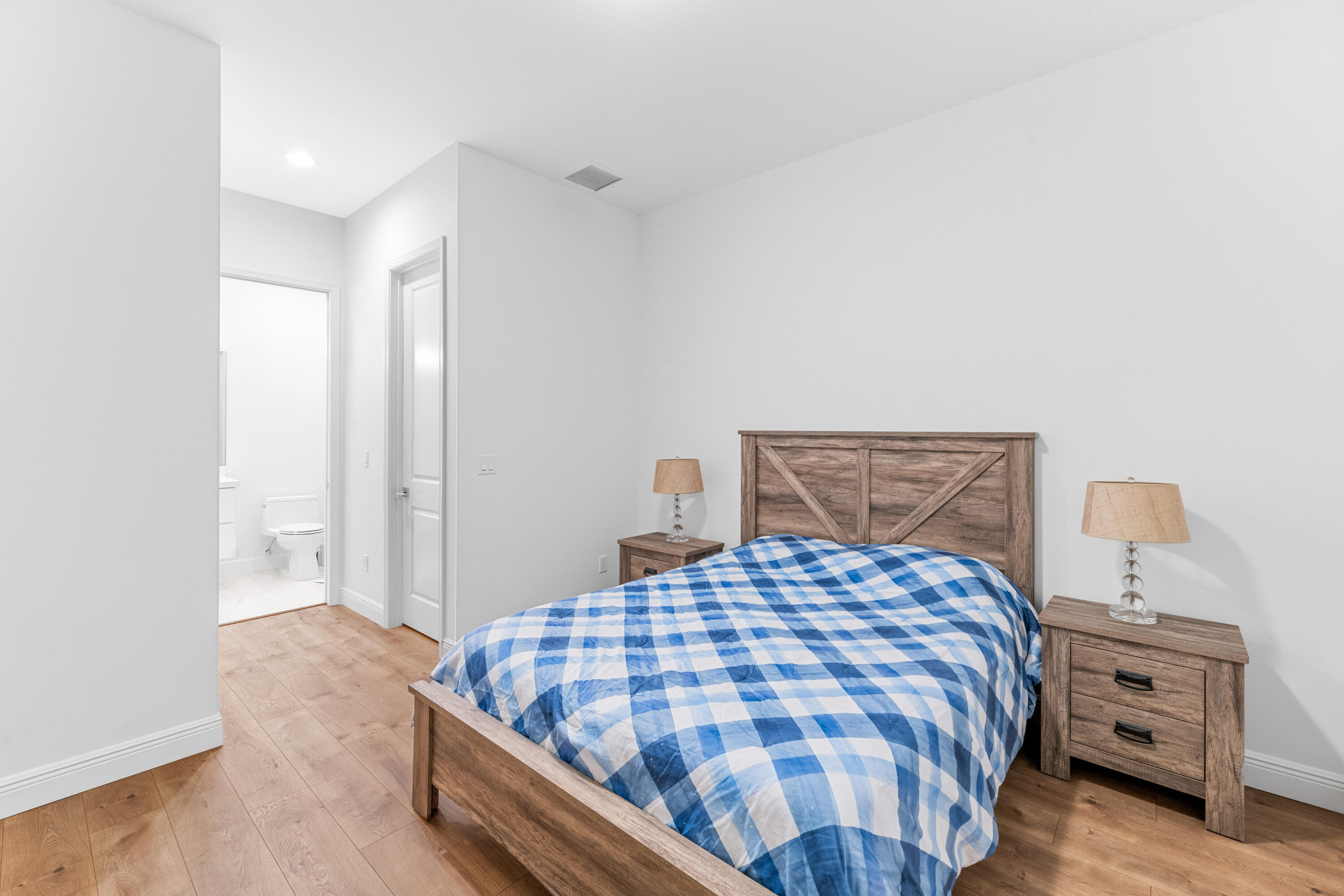 14739 Jumper Road Wellington, FL 33449 - Photo 123 of 124 a bedroom with a bed and dresser