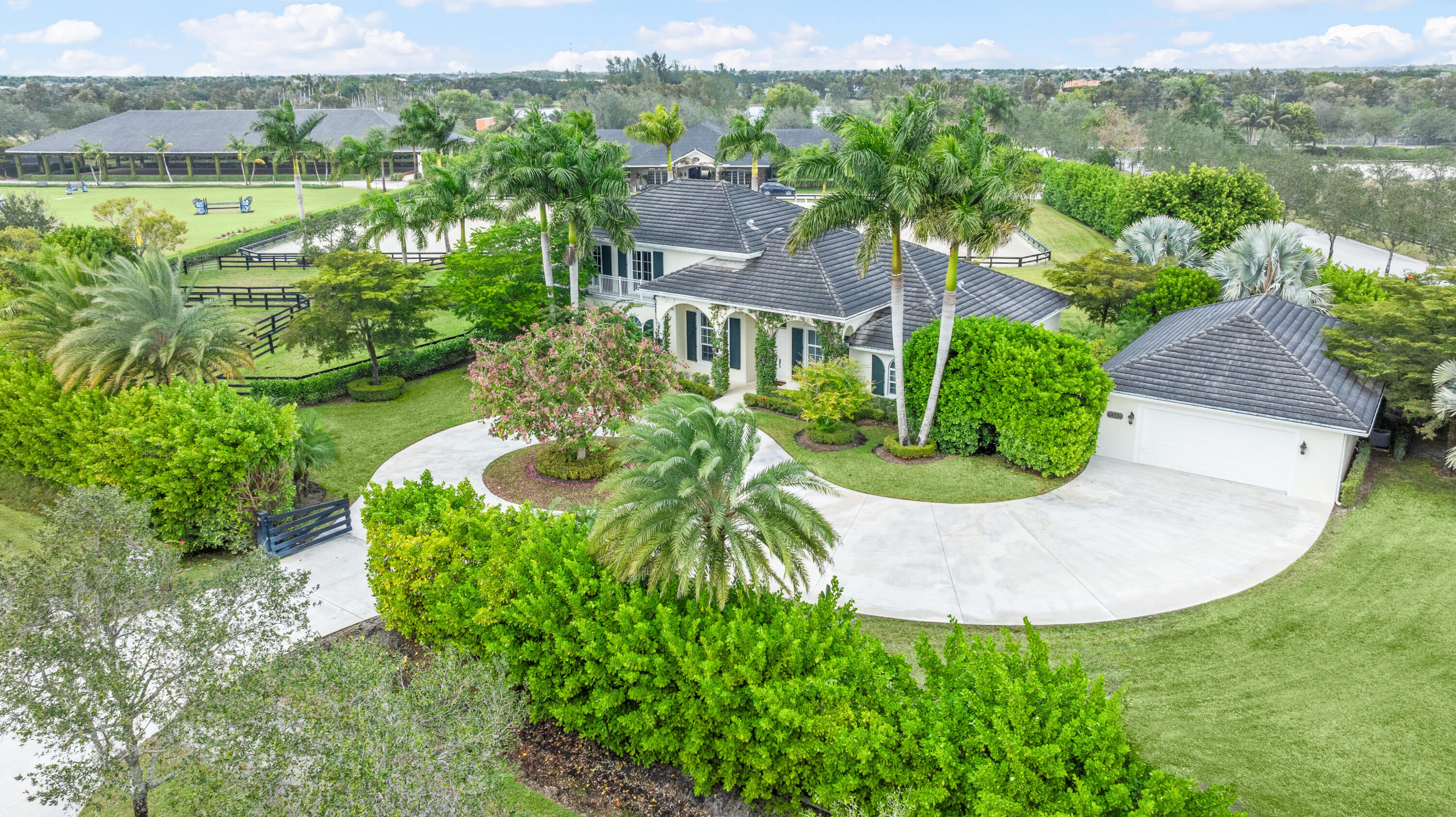 14739 Jumper Road Wellington, FL 33449 - Photo 16 of 124 an aerial view of residential house with outdoor space and trees all around