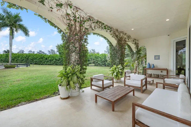 a spacious bathroom with a double vanity sink a mirror and a bathtub