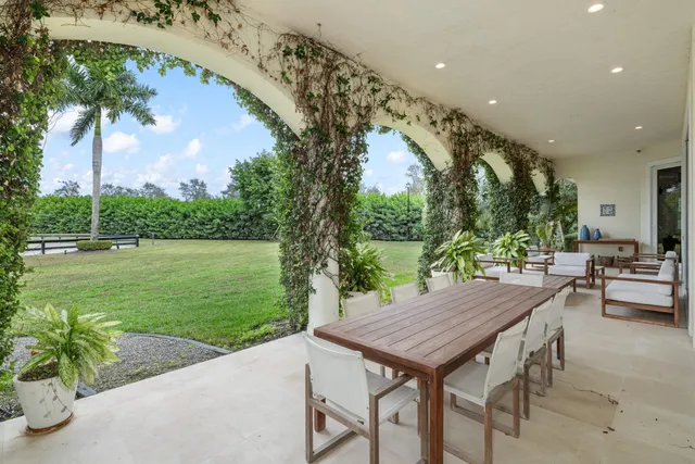a bathroom with a toilet a sink a mirror and shower