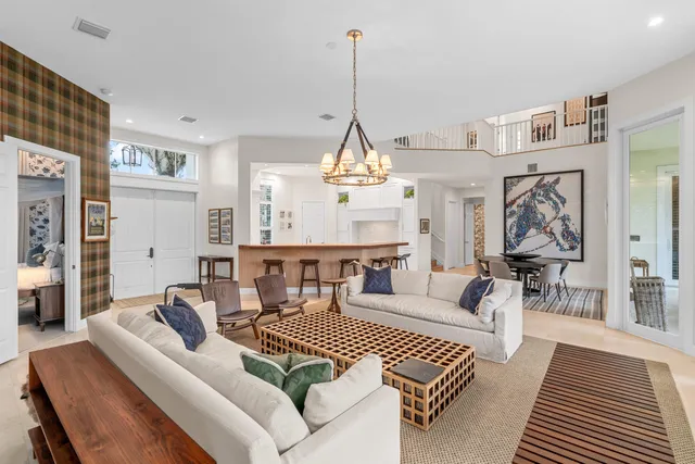 a living room with furniture and a table