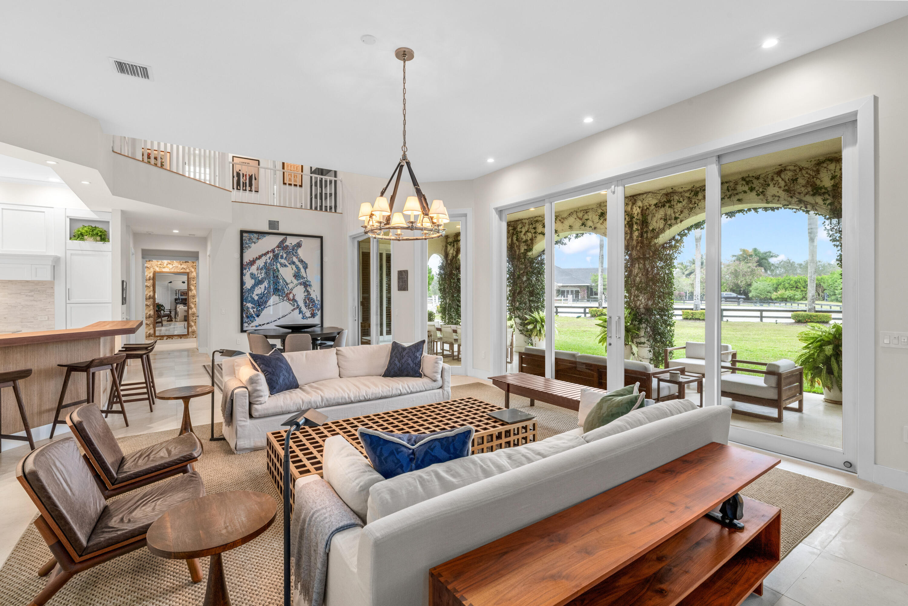 14739 Jumper Road Wellington, FL 33449 - Photo 32 of 124 a living room with furniture ceiling fan and a window