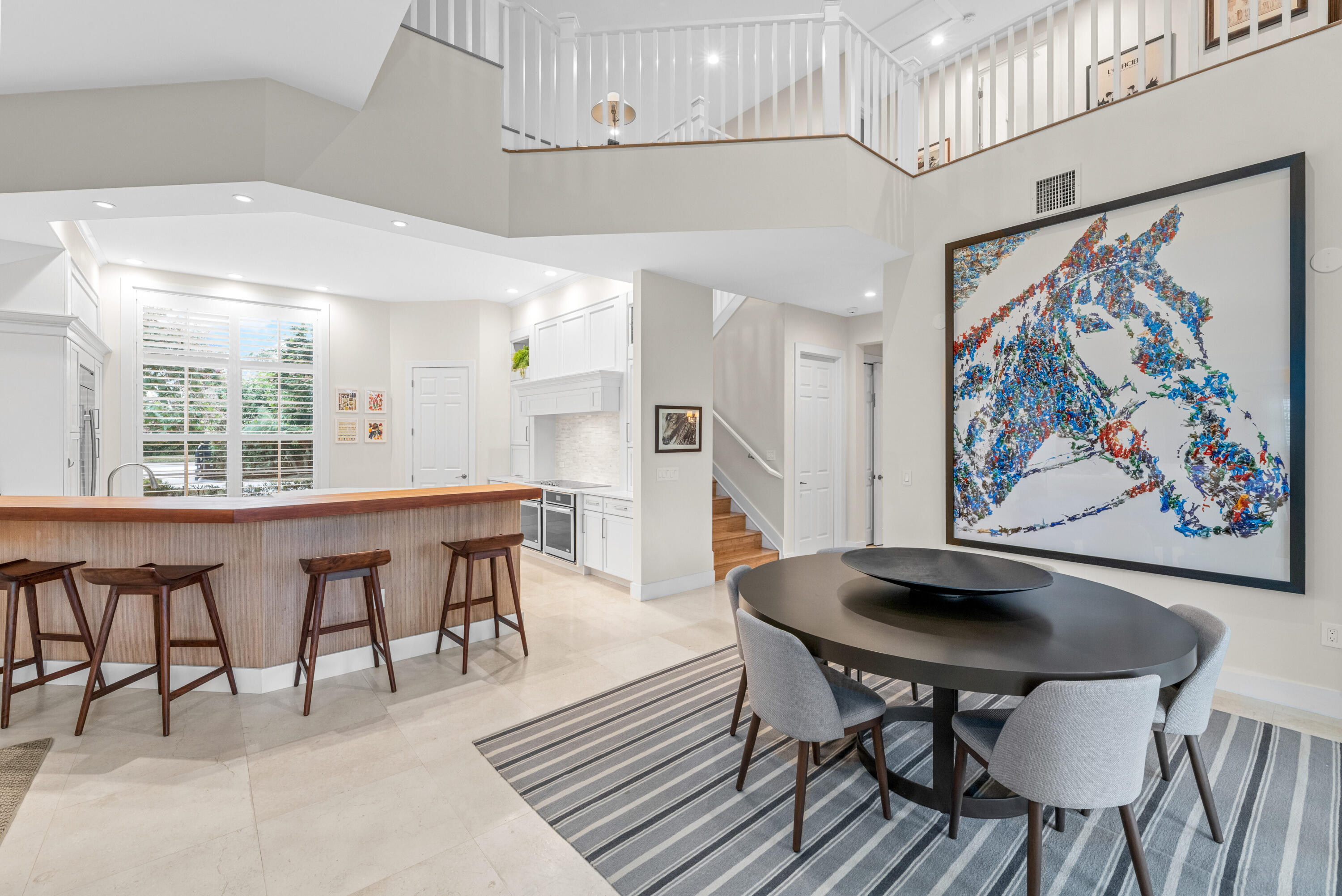 14739 Jumper Road Wellington, FL 33449 - Photo 37 of 124 a view of a dining room with furniture a rug and wooden floor