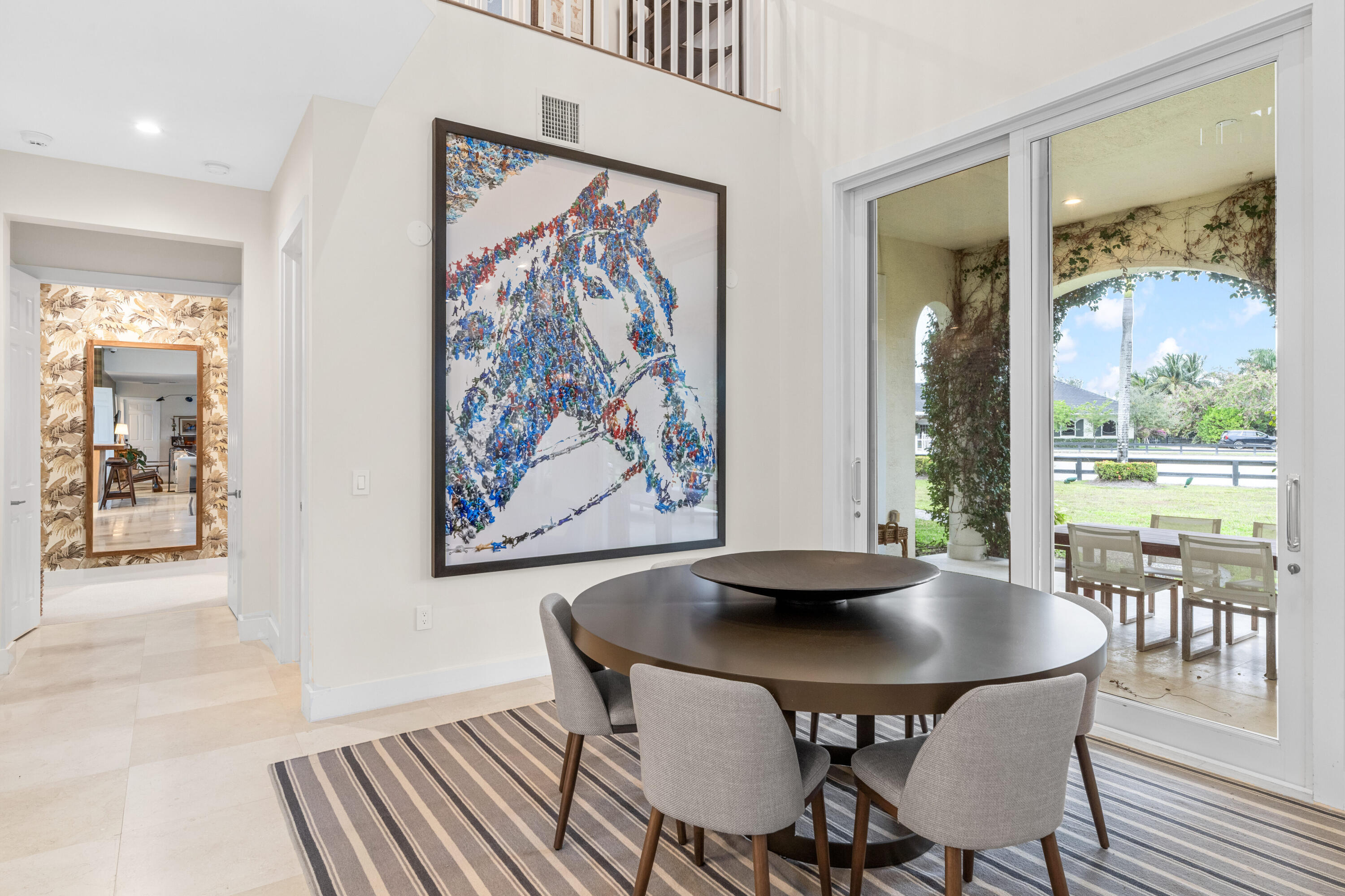 14739 Jumper Road Wellington, FL 33449 - Photo 38 of 124 a view of a dining room with furniture and wooden floor
