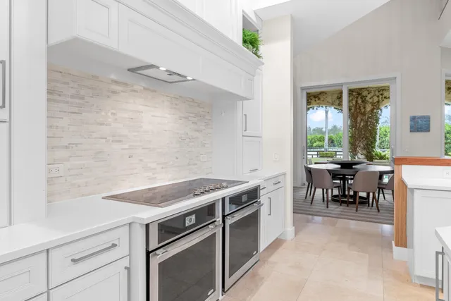 a front view of a house with a yard and a garage