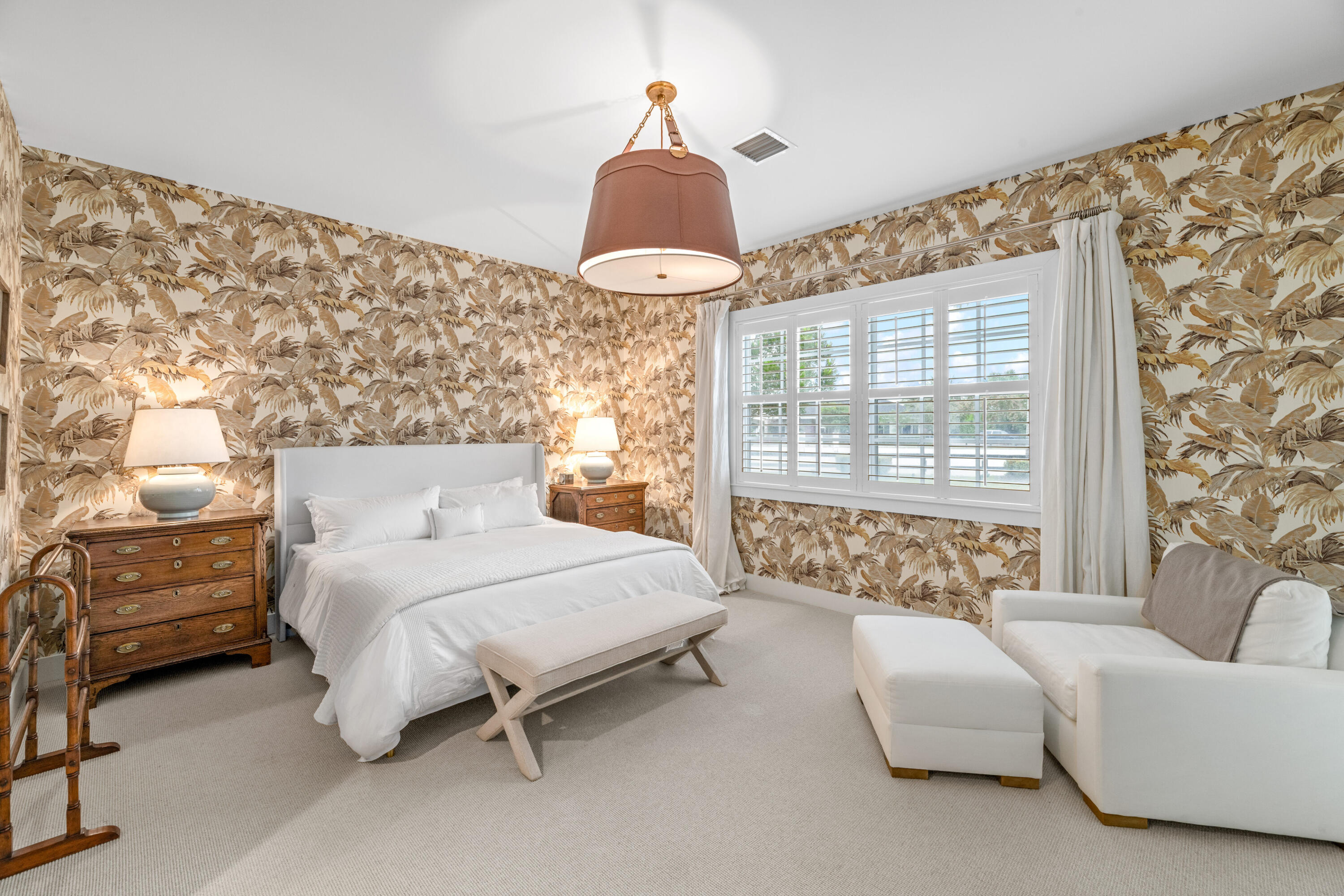 14739 Jumper Road Wellington, FL 33449 - Photo 50 of 124 a bedroom with a bed and a chandelier