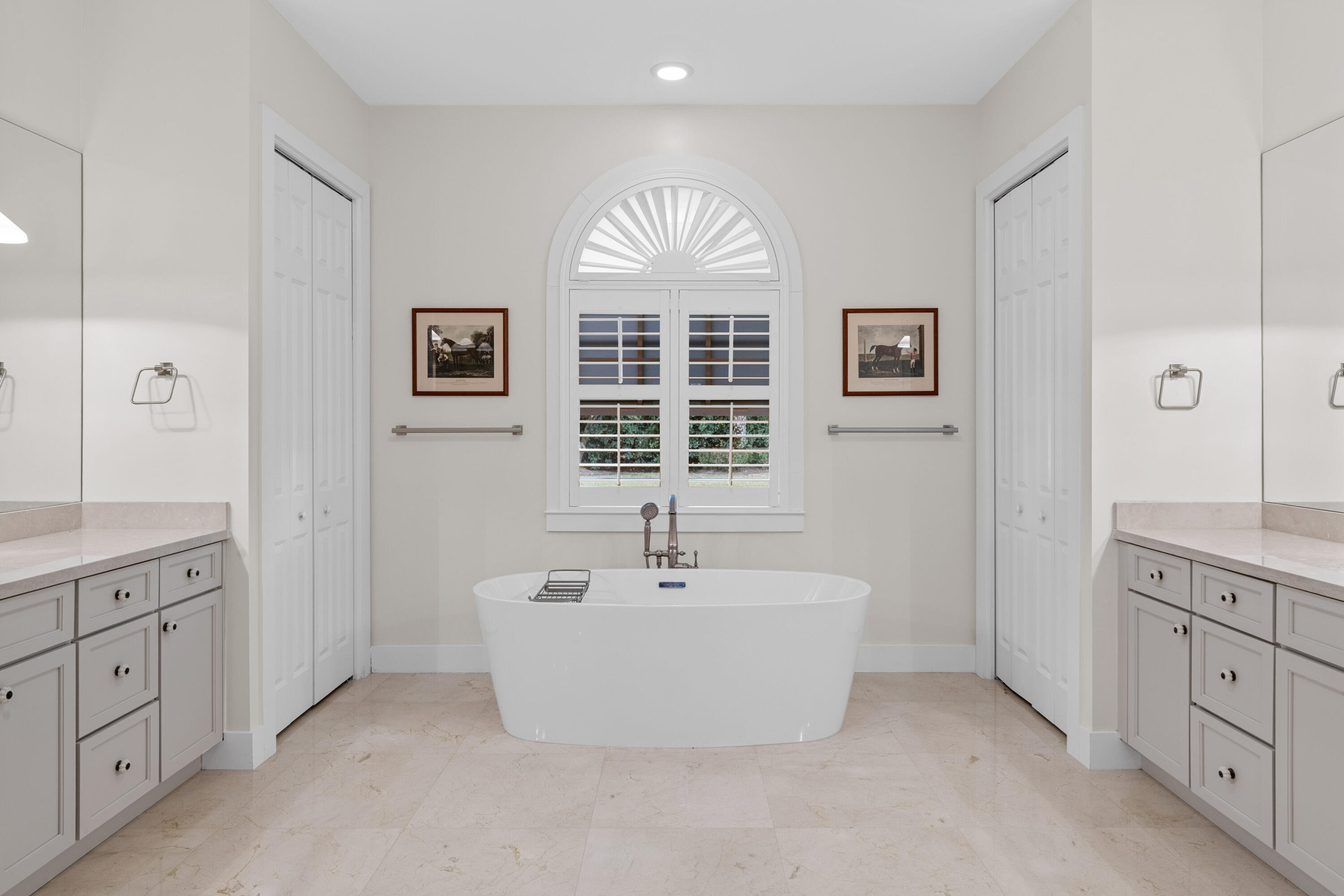 14739 Jumper Road Wellington, FL 33449 - Photo 52 of 124 a spacious bathroom with double vanity sink a two mirror a window and a bathtub