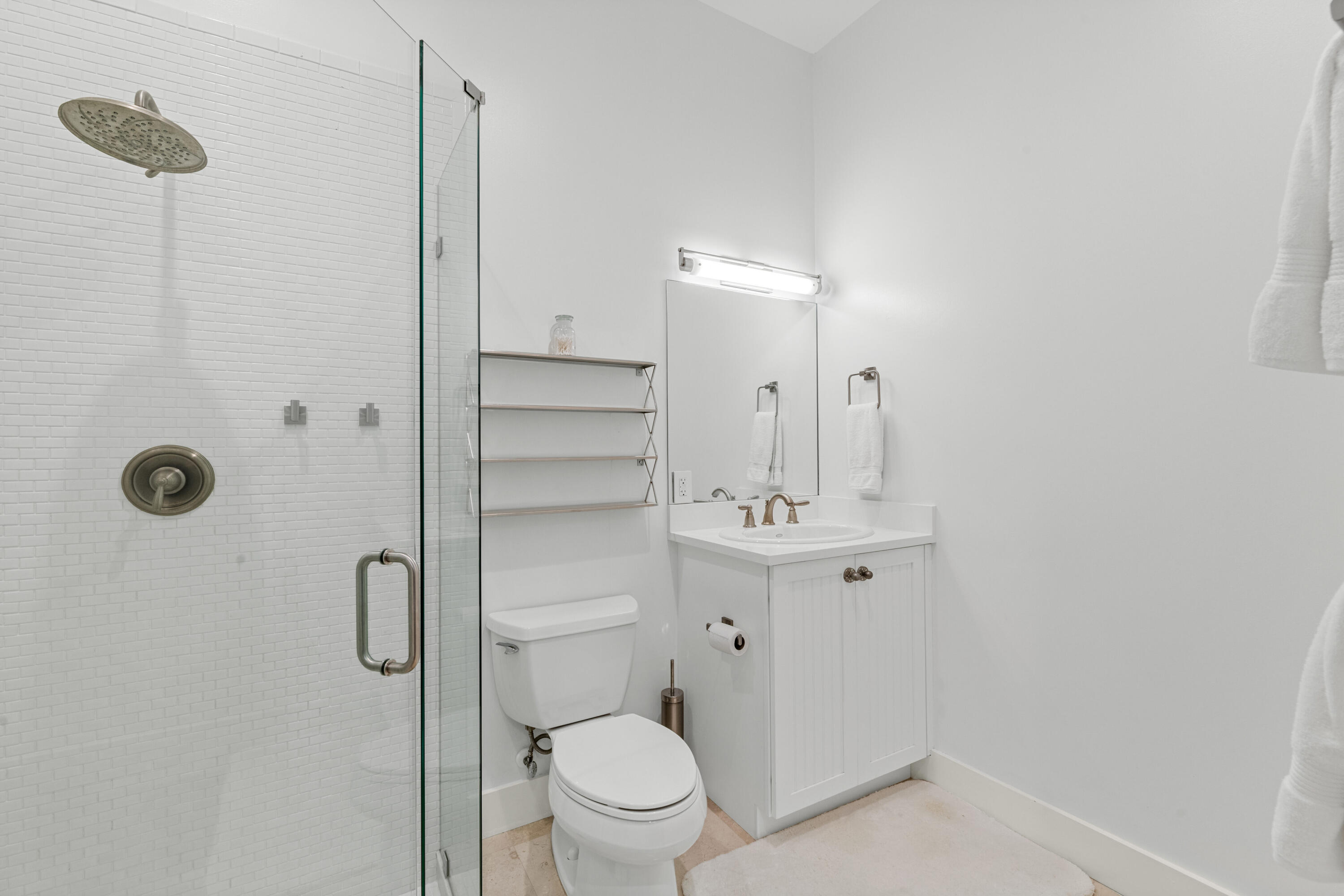 14739 Jumper Road Wellington, FL 33449 - Photo 57 of 124 a bathroom with a toilet a sink a mirror and shower
