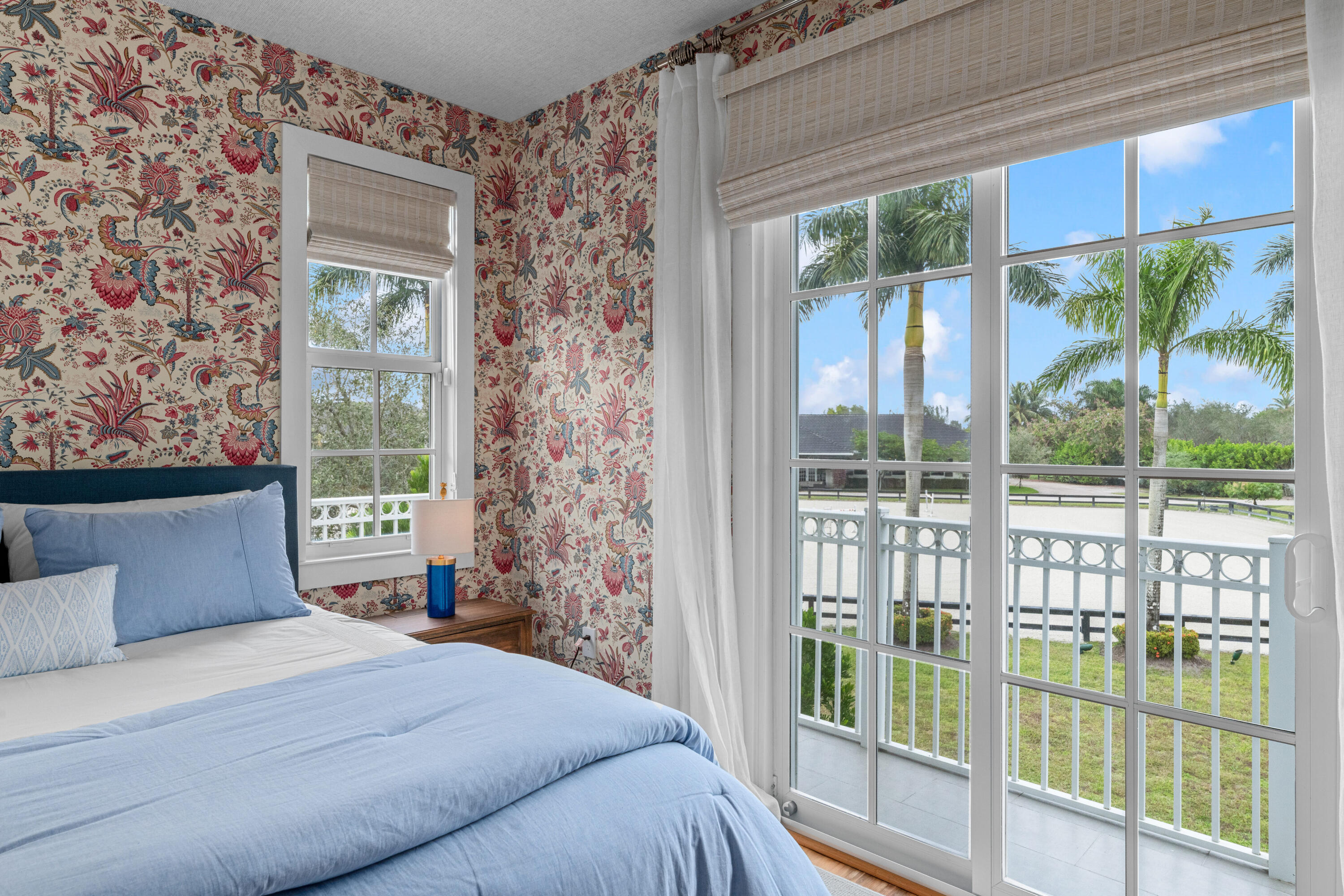 14739 Jumper Road Wellington, FL 33449 - Photo 63 of 124 a bedroom with a large bed and a large window