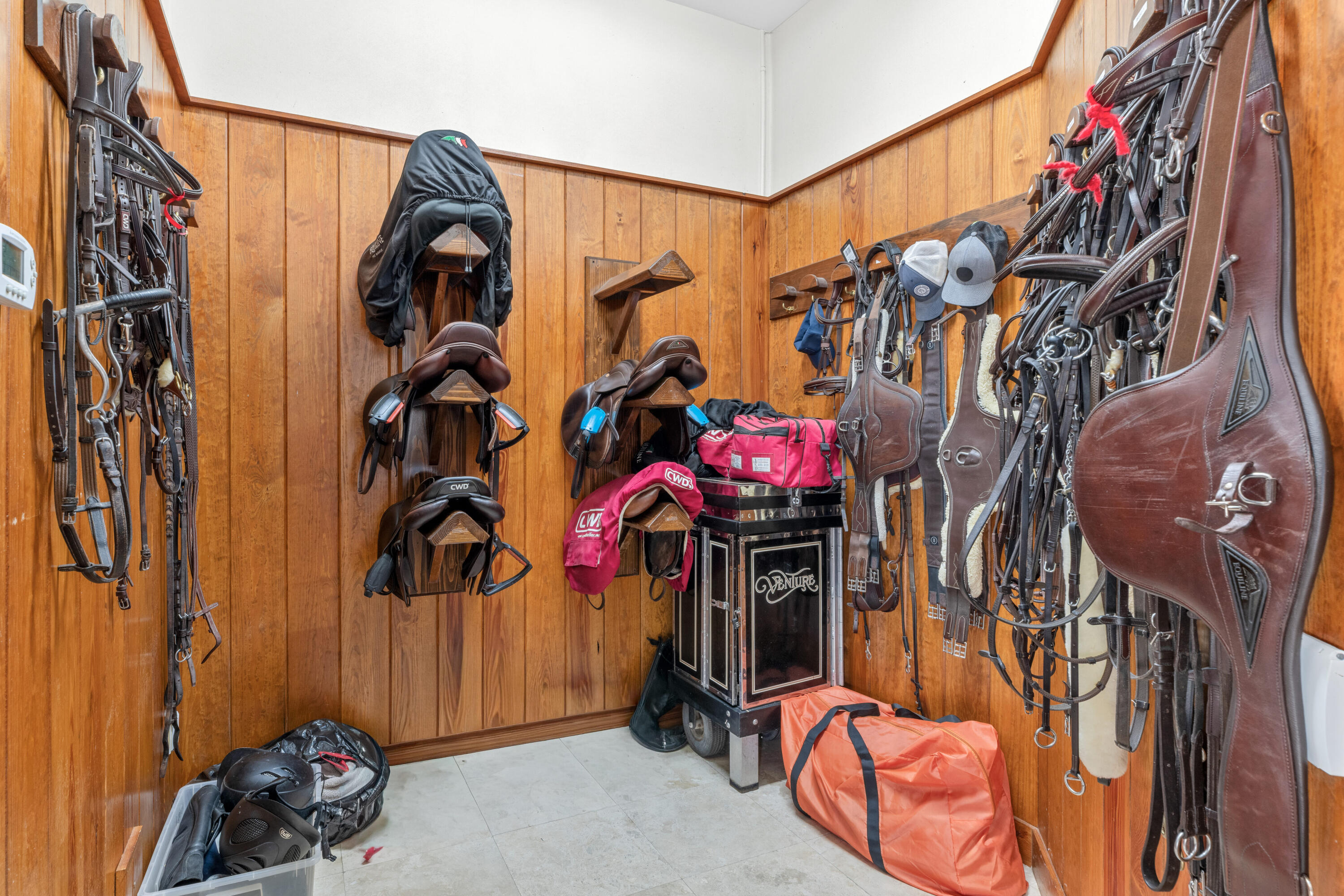 14739 Jumper Road Wellington, FL 33449 - Photo 96 of 124 a view of walk in closet with clothes and shoes