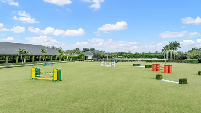 a view of a swimming pool with a patio and a garden