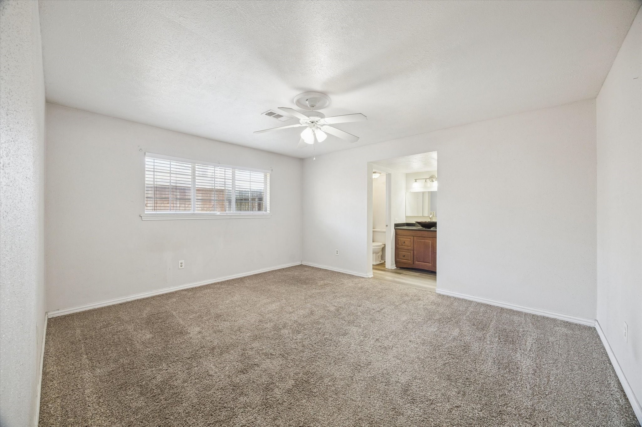 135 Mill Stream Lane Houston, TX 77060 - Photo 10 of 16 Primary bedroom with ensuite bathroom