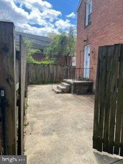 a swimming pool with wooden fence