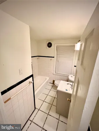 a bathroom with a sink a mirror and shower